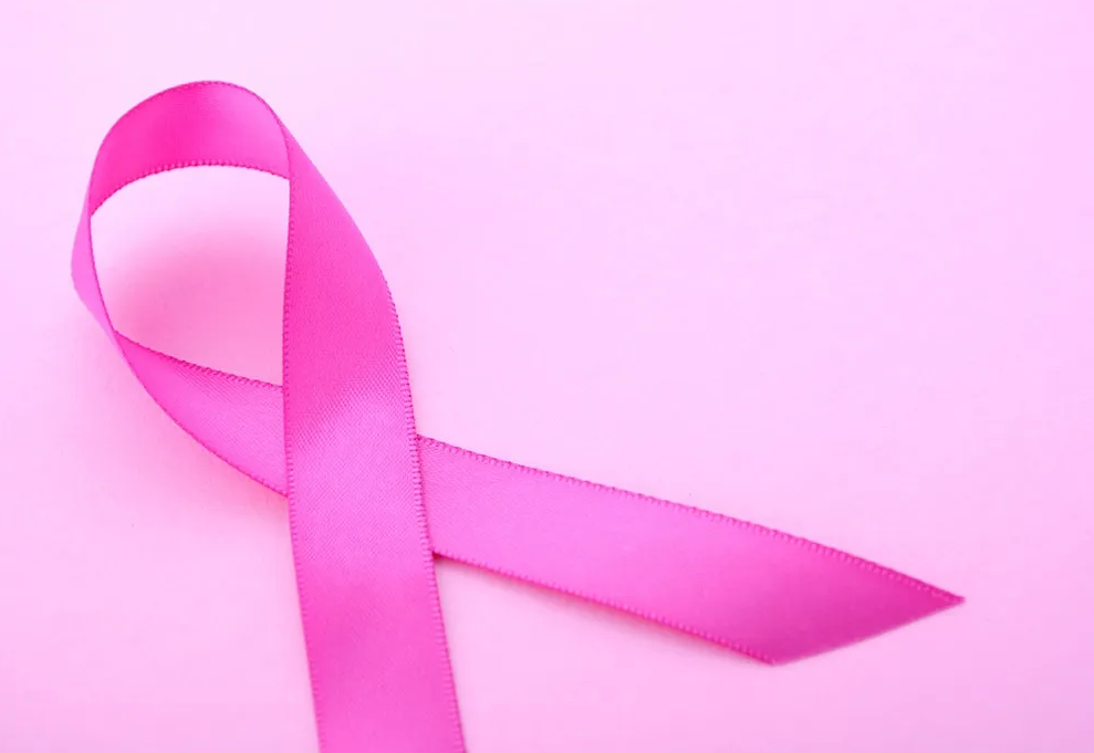 A dark pink ribbon on a light pink background.
